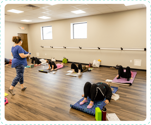 People practicing yoga on mats